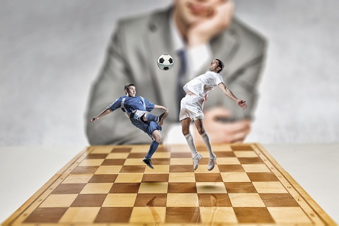 Fussballer auf Schachbrett